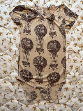 Kate Quinn puff sleeve hot air balloon bodysuit